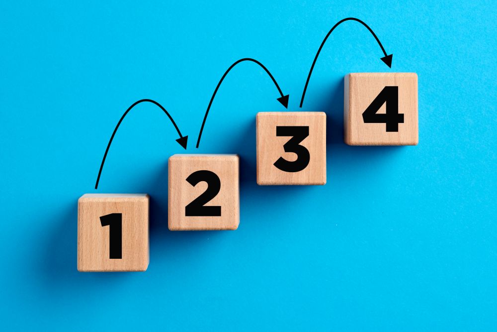 Step By Step Numbers With Arrows On Wooden Cubes