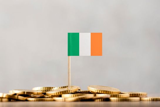 Irish Flag Stuck In Pile Of Coins